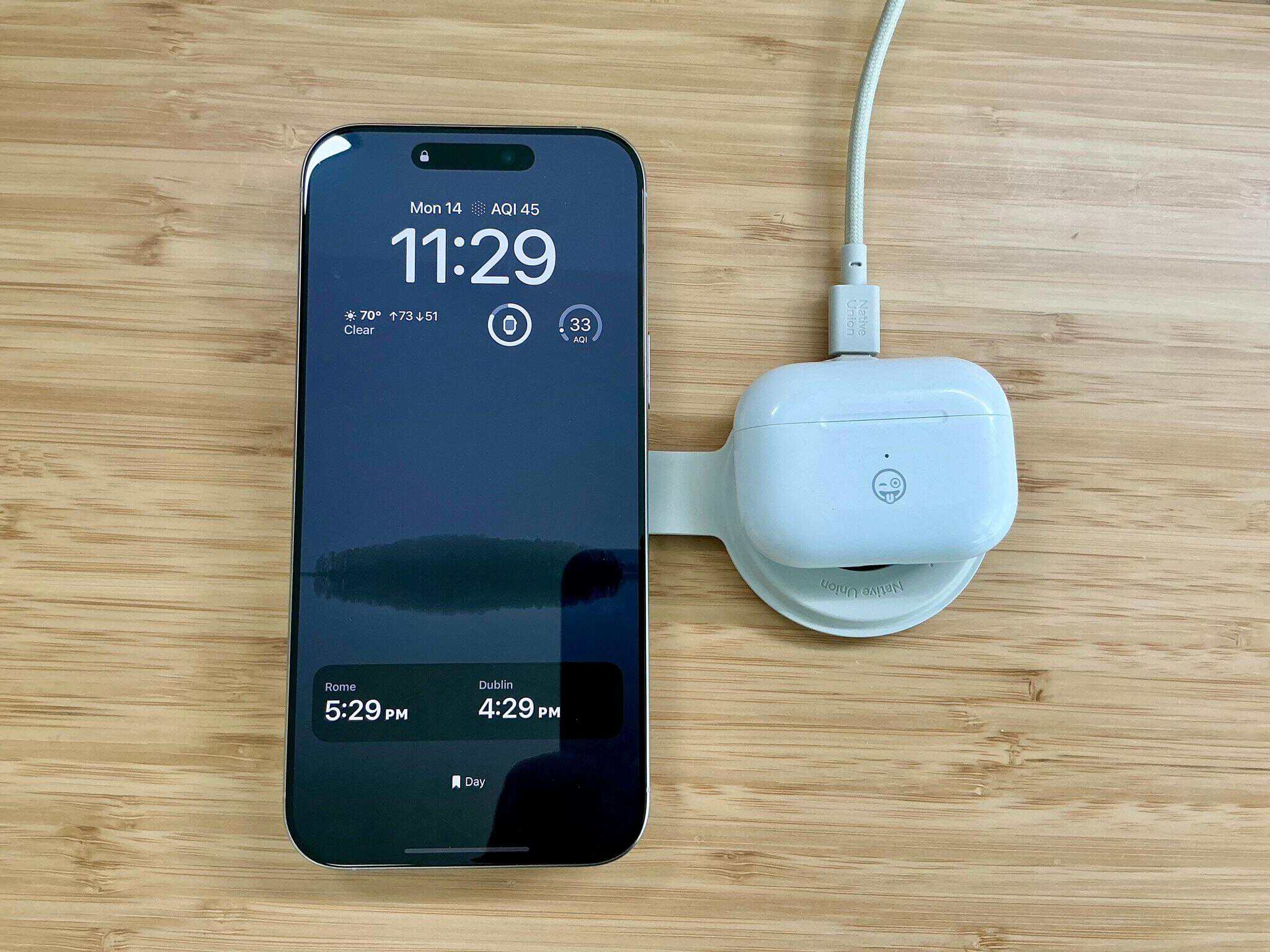 Charging an iPhone and AirPods Pro 2.