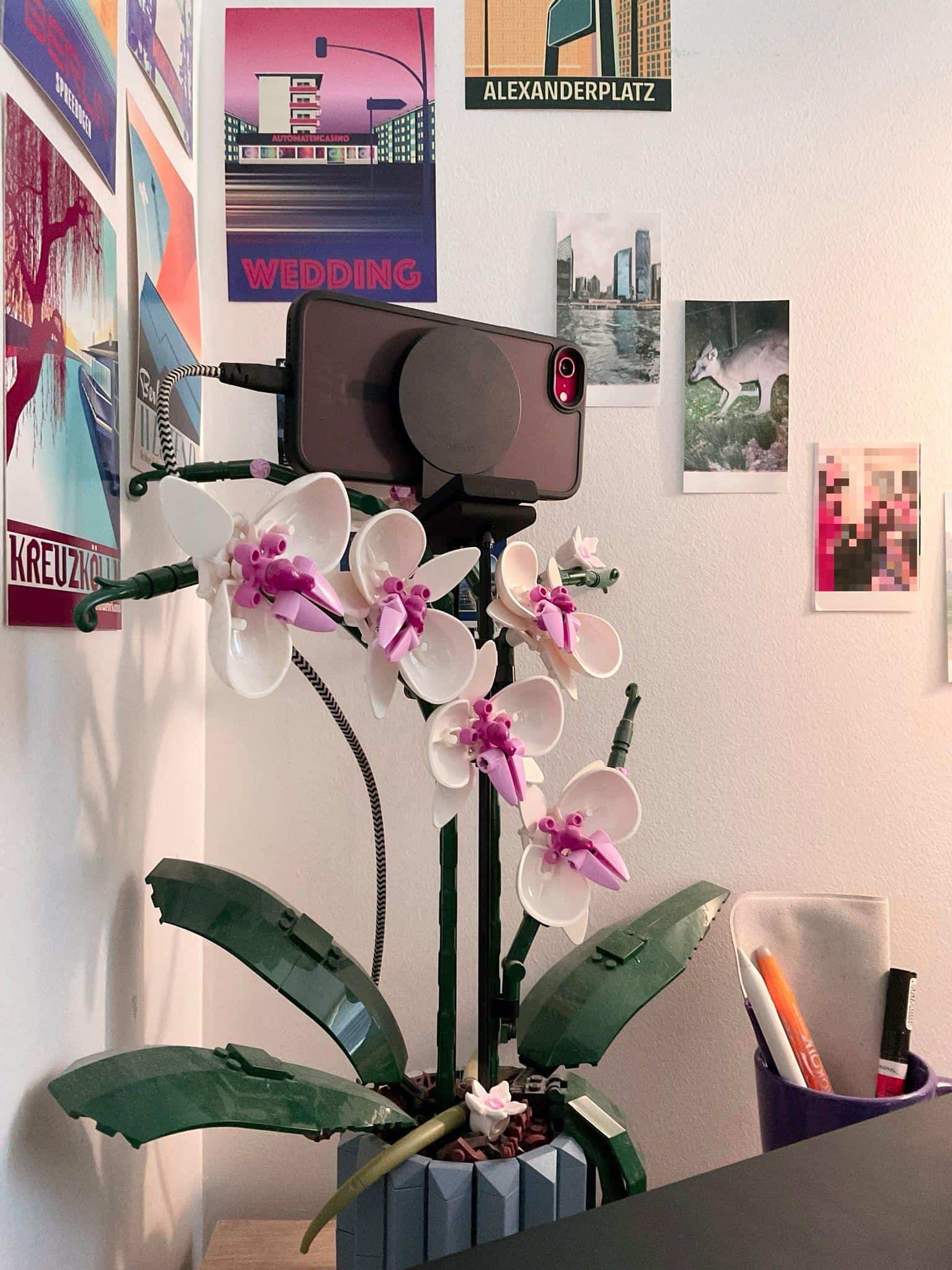 Here's my genius video recording contraption made out of an old iPhone SE, a MagSafe mount, and a LEGO plant.