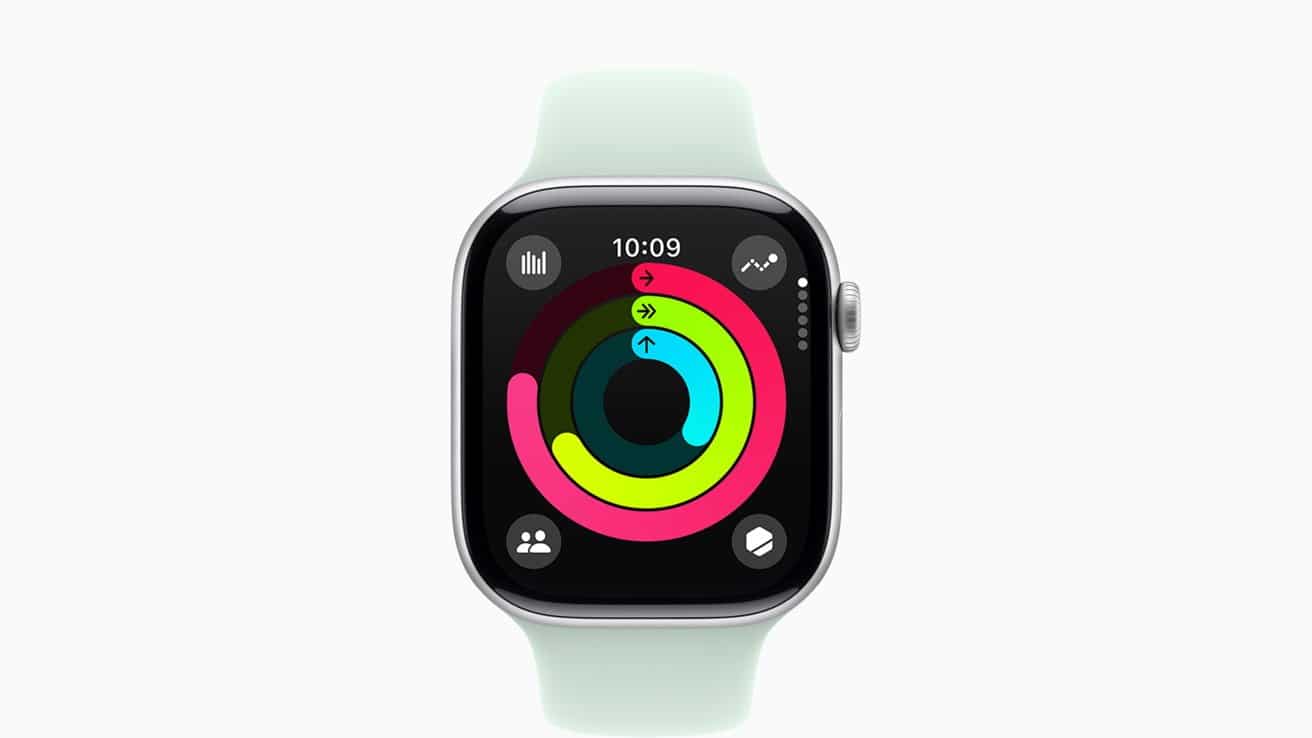 Smartwatch with green band showing colorful activity rings on black display at 10:09.