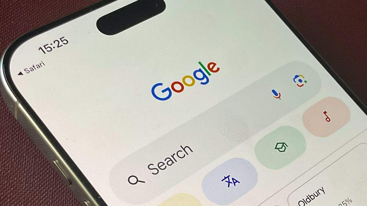 Smartphone screen displaying a Google search page within the Safari browser, showing colorful icons and buttons for various functions.