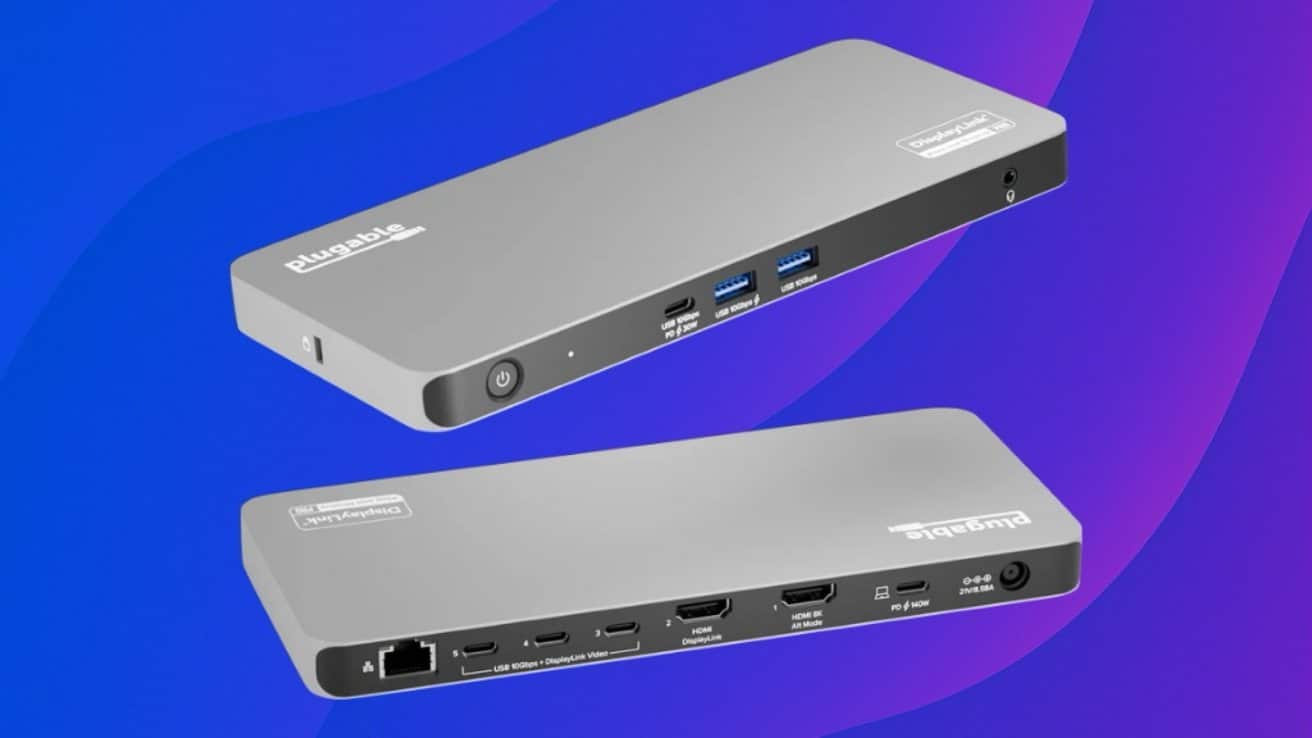 Sleek gray docking station with multiple ports on a purple gradient background, showing USB, HDMI, and Ethernet connections.