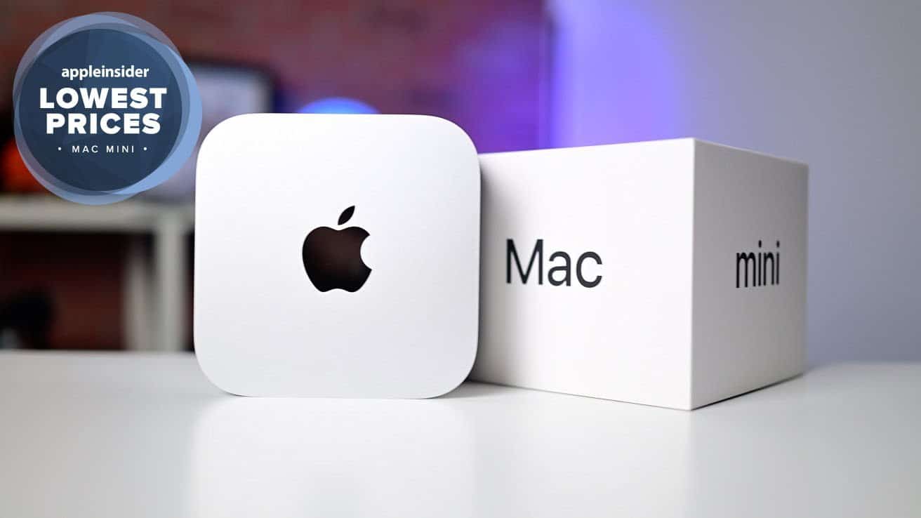 Apple Mac mini is displayed next to its box on a table. A blue badge reads 'Lowest Prices.' Background shows a blurred setting.