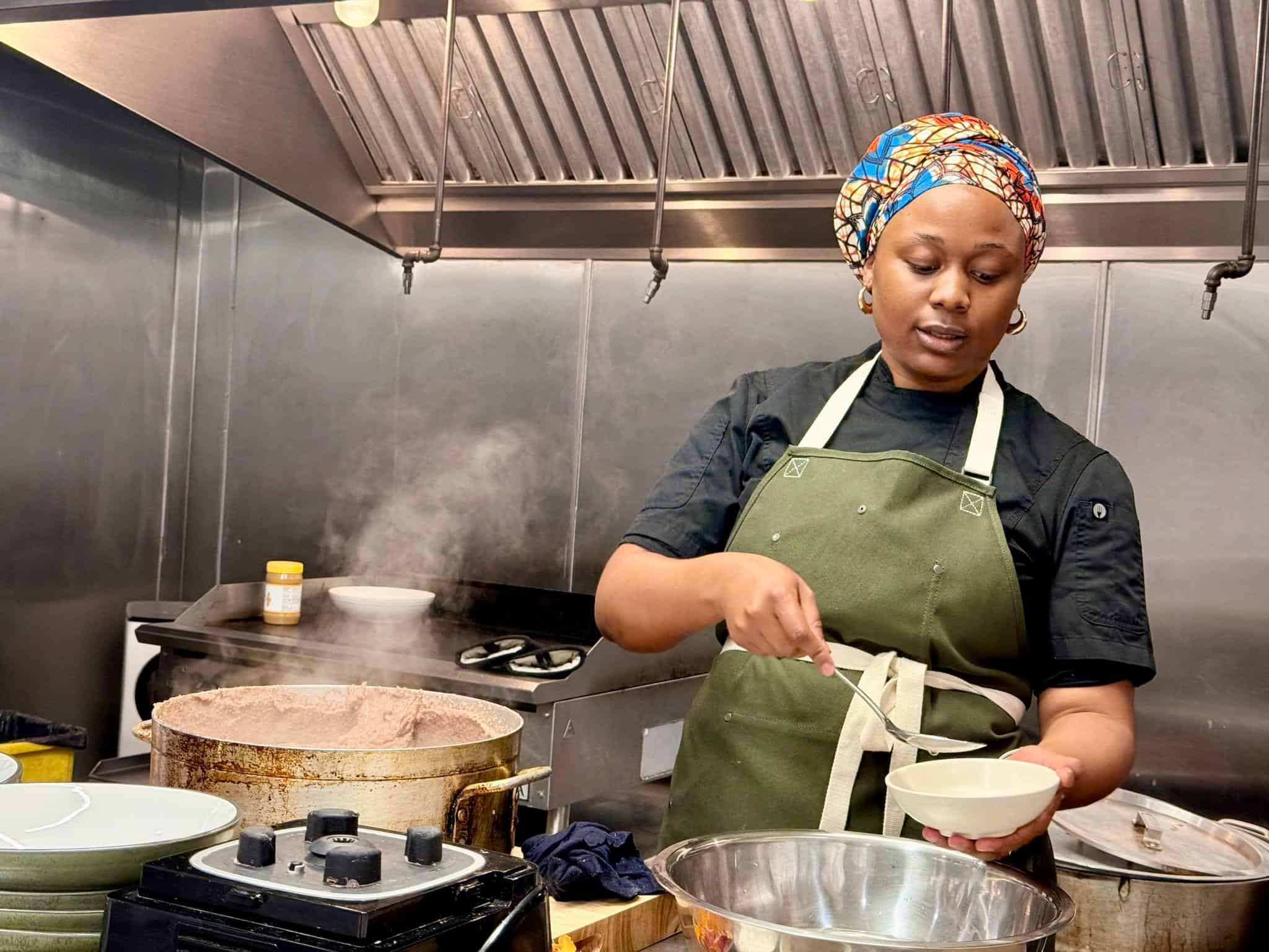 Chef Grace explaining how to serve sadza.