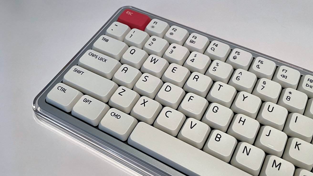 White keyboard with black lettering, featuring a red 'Esc' key in the top left corner and other customizable keys in neat rows.