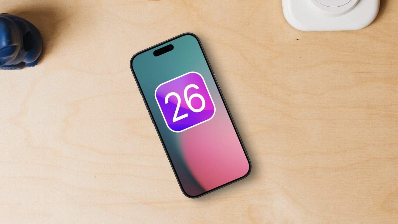 Smartphone on wooden table, displaying a colorful screen with a '26' icon, next to a small blue object.