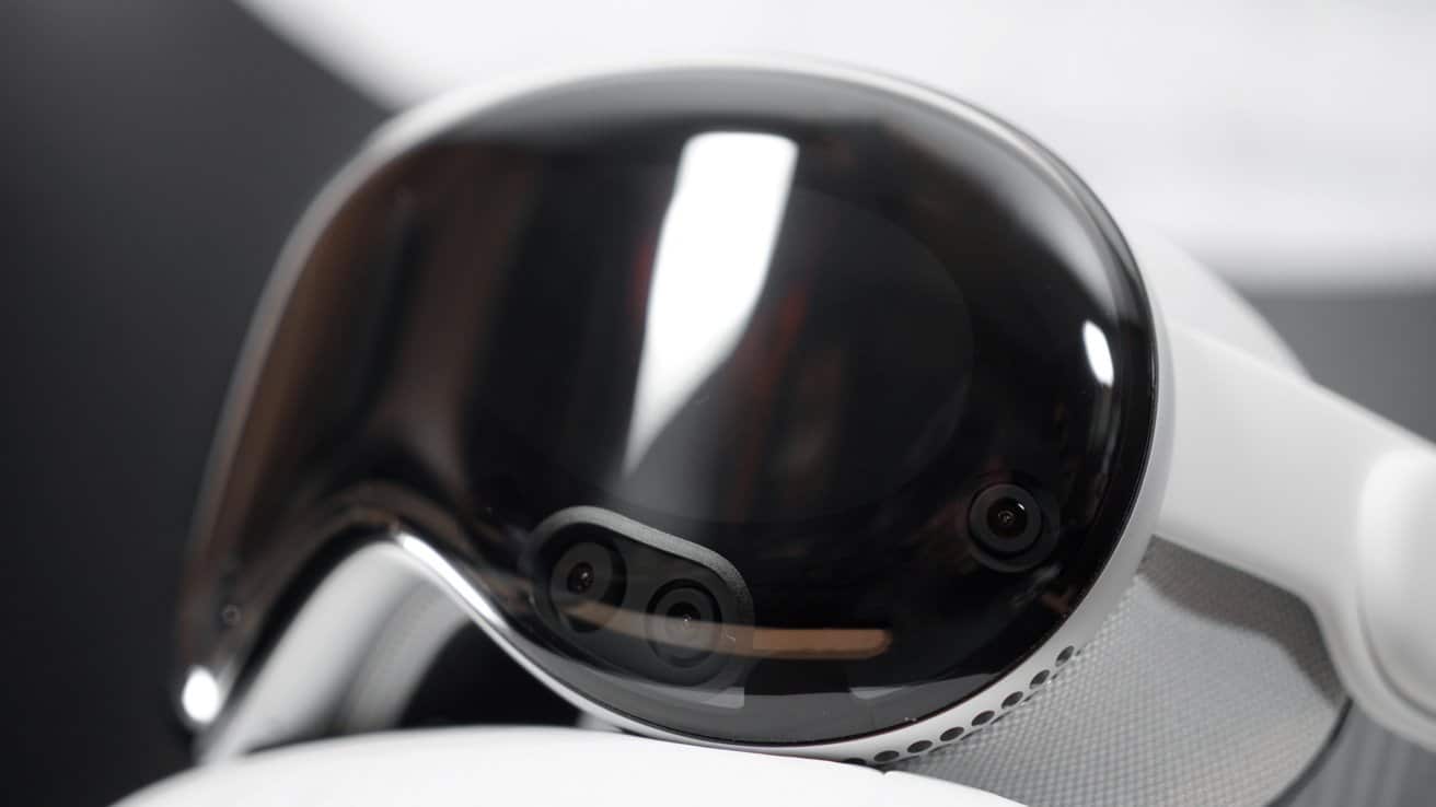 Sleek black and white virtual reality headset with glossy reflective visor and visible front-facing cameras.