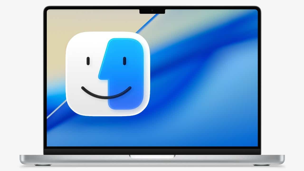 Laptop displaying a blue gradient screen with a large smiling face icon in the center.