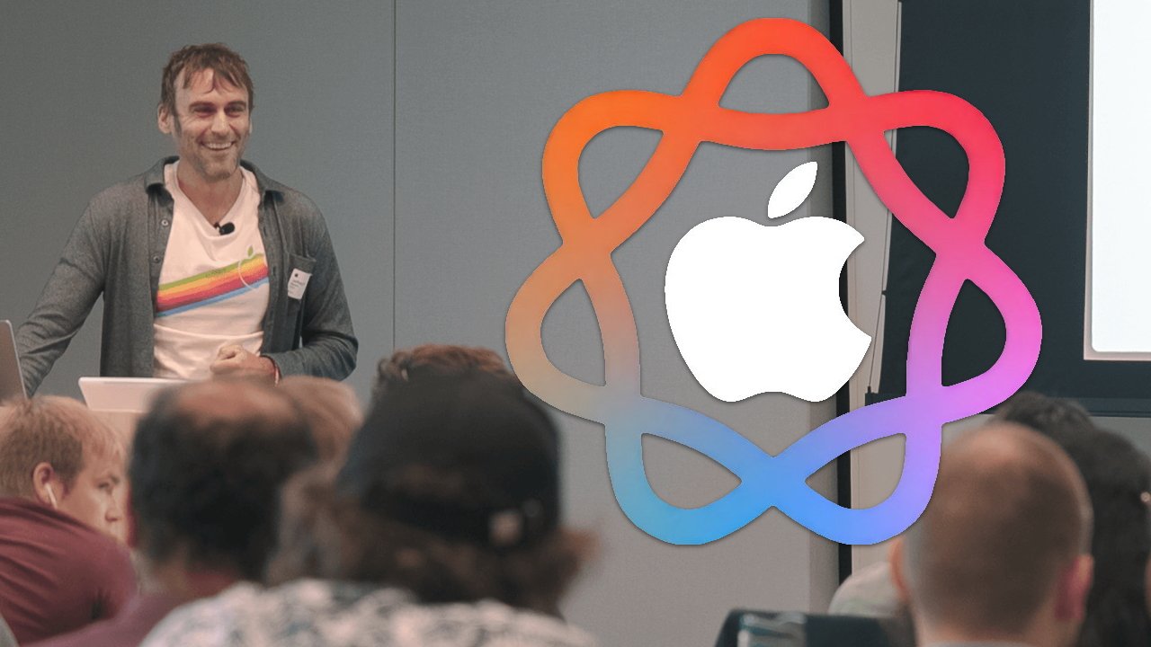 Smiling person speaking to an audience, wearing a shirt with a colorful logo. Large Apple logo overlay.