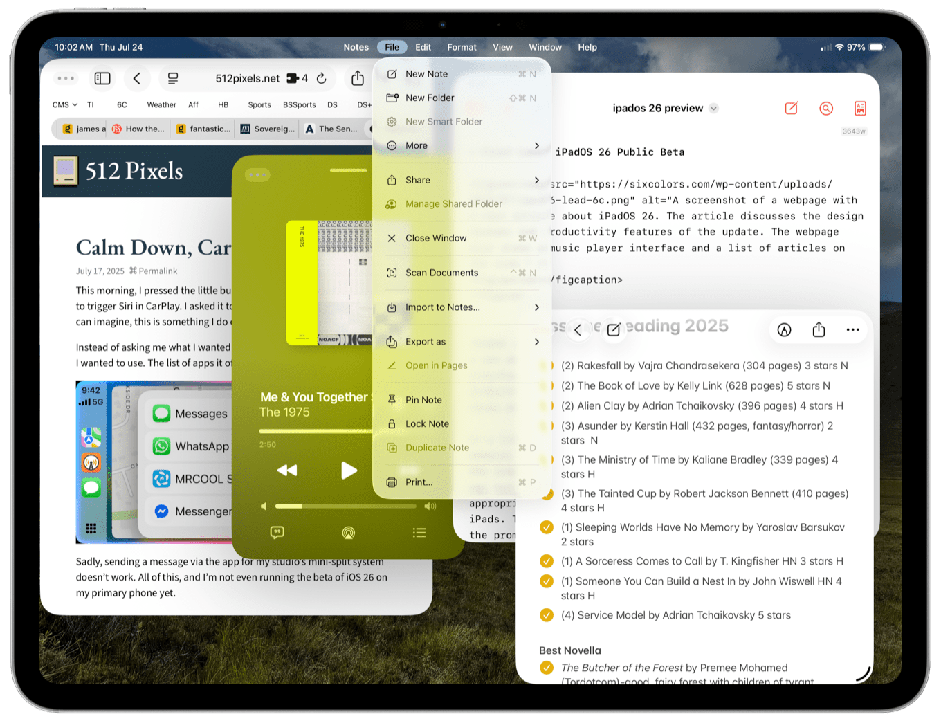 Screenshot of a tablet displaying a webpage, a note-taking app, and a music player.