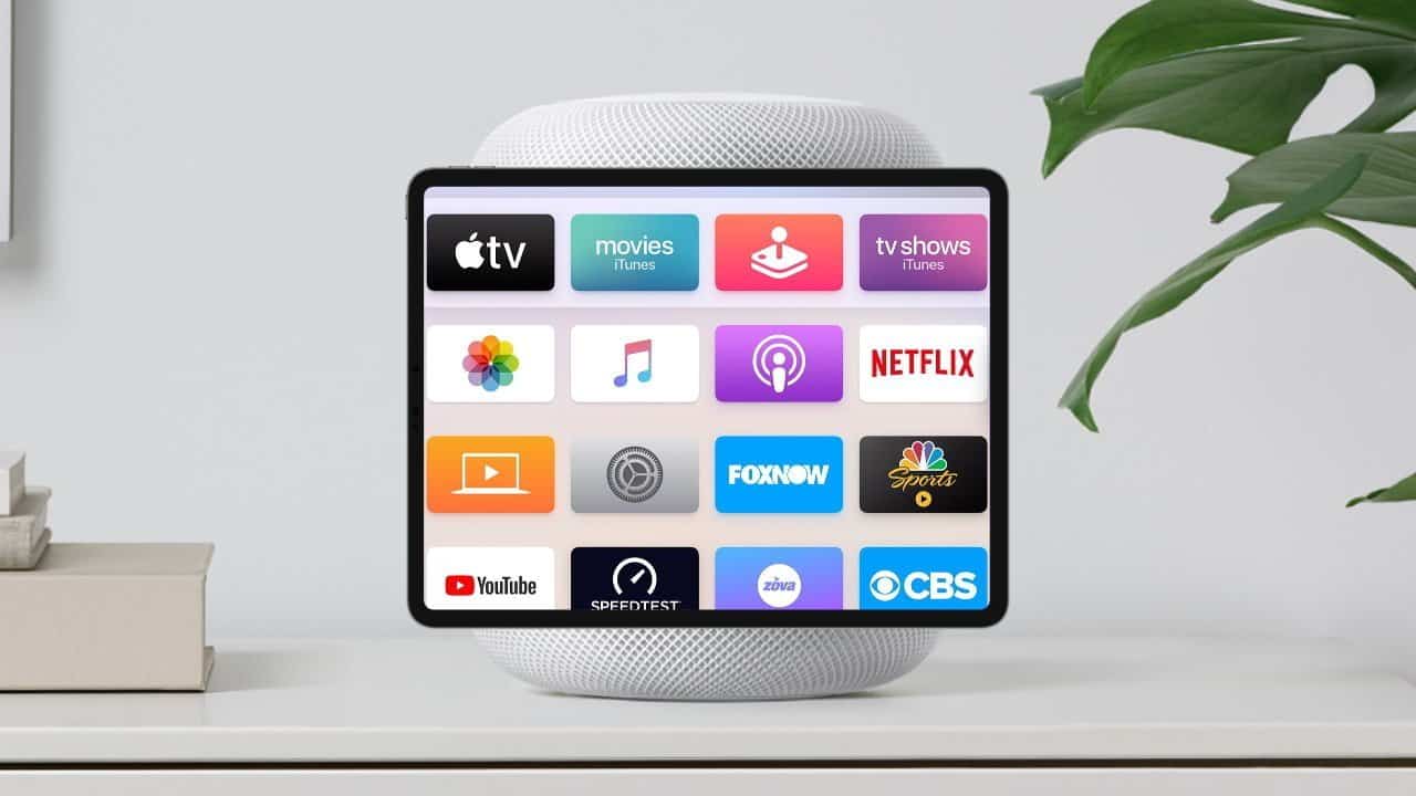 Tablet displaying various streaming and media app icons, including Apple TV, Netflix, and YouTube, on a stand next to potted green plant on a white surface.