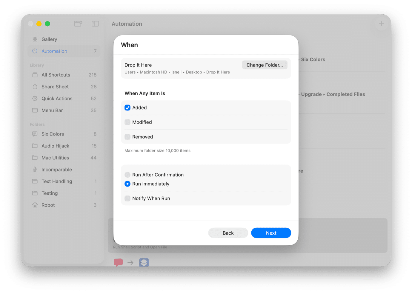Screenshot of an automation setup on a Mac. Left: 'Gallery' sidebar with folders like 'All Shortcuts.' Right: 'When' section with options to drop items in a folder, trigger actions on 'Added,' 'Modified,' or 'Removed,' and choose run settings. 'Next' button at bottom.