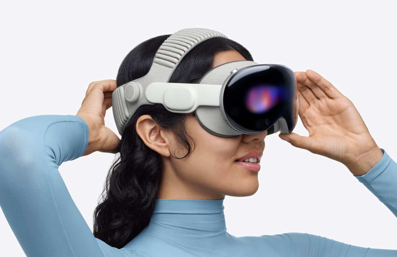 a woman wearing a virtual reality headset with a white strap and a black front panel