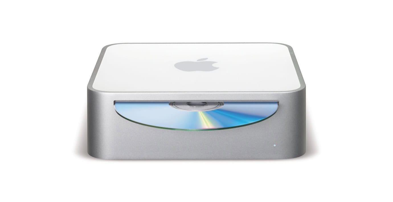 Silver Apple computer with a disc drive on a white background.